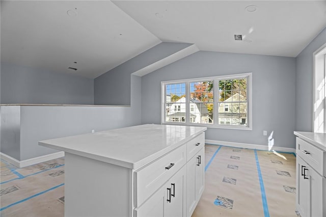 walk in closet featuring vaulted ceiling