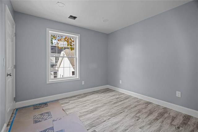 empty room with light wood-type flooring