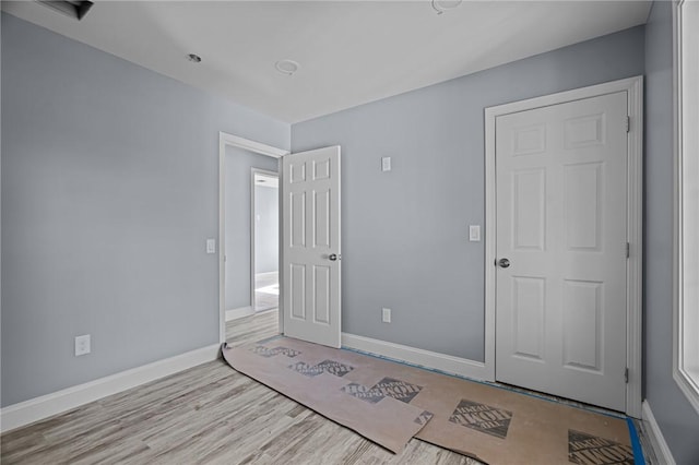 unfurnished bedroom featuring light hardwood / wood-style floors