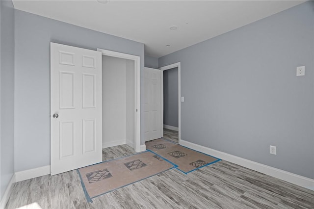 unfurnished bedroom with light hardwood / wood-style floors