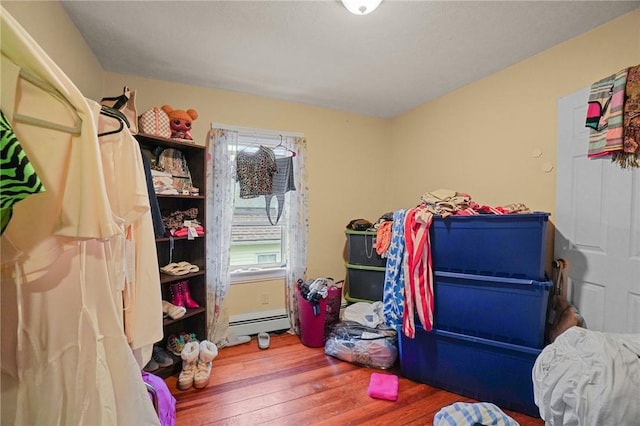 storage room with a baseboard heating unit