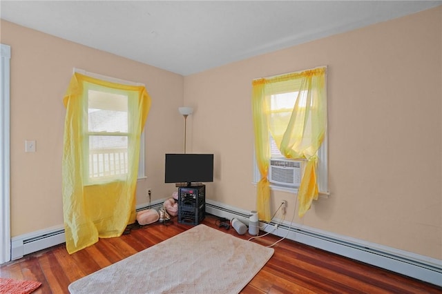 miscellaneous room featuring a baseboard radiator, dark hardwood / wood-style floors, and cooling unit