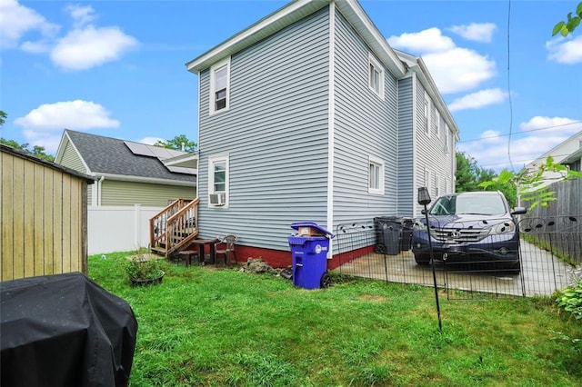 view of home's exterior featuring a lawn