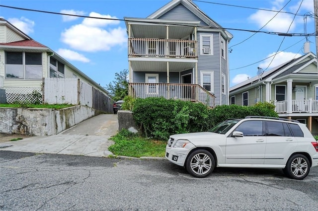 view of front of house with a balcony