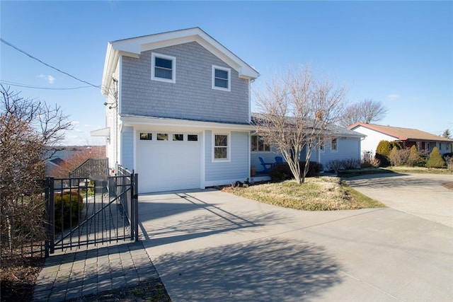 traditional-style home with driveway and a gate