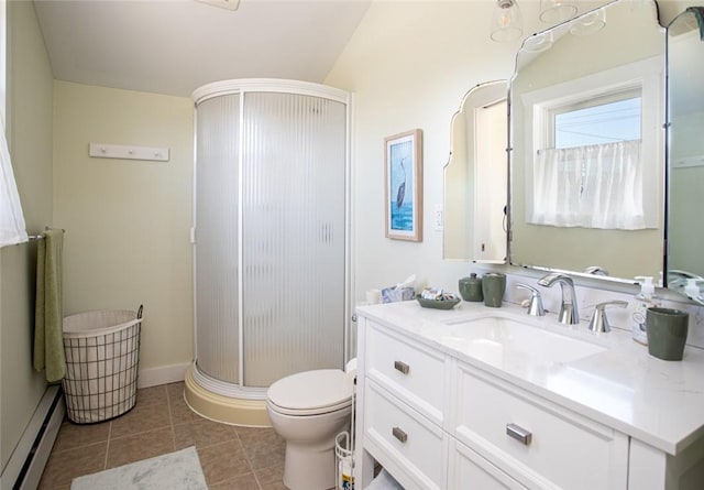 full bathroom with tile patterned flooring, toilet, a baseboard heating unit, vanity, and a stall shower