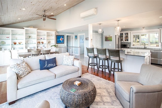 living area with lofted ceiling, recessed lighting, wood ceiling, a wall mounted AC, and light wood-type flooring