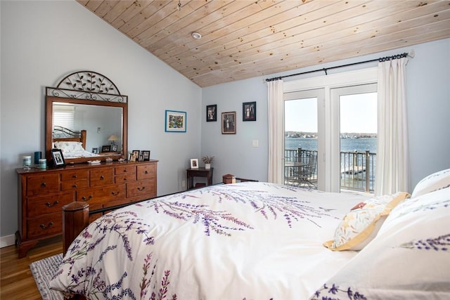 bedroom with lofted ceiling, wooden ceiling, a water view, wood finished floors, and access to exterior