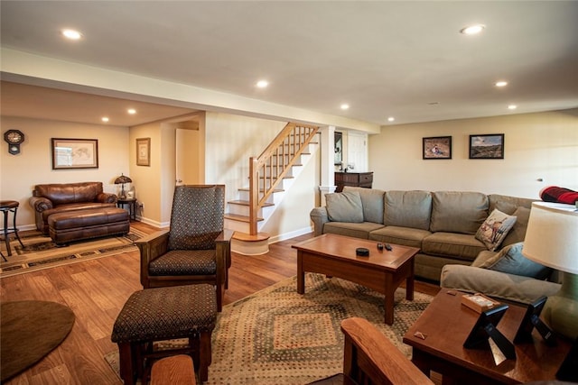 living area with stairs, recessed lighting, baseboards, and wood finished floors