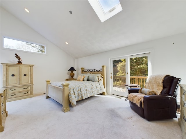 carpeted bedroom featuring access to outside and lofted ceiling with skylight