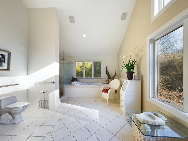 bathroom featuring separate shower and tub, tile patterned flooring, vaulted ceiling, and toilet