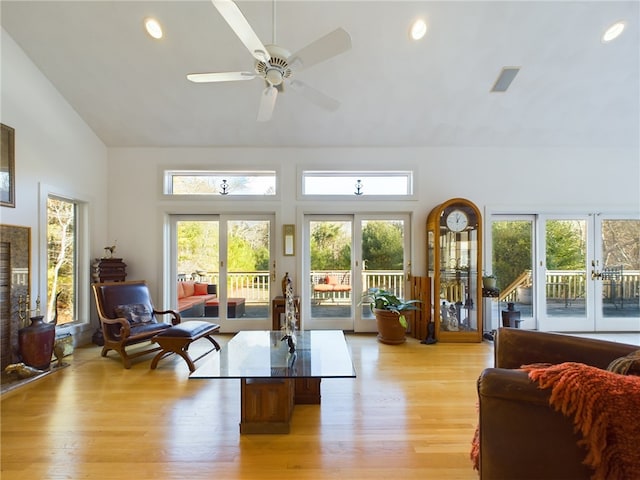 living room with ceiling fan, light wood-type flooring, and french doors