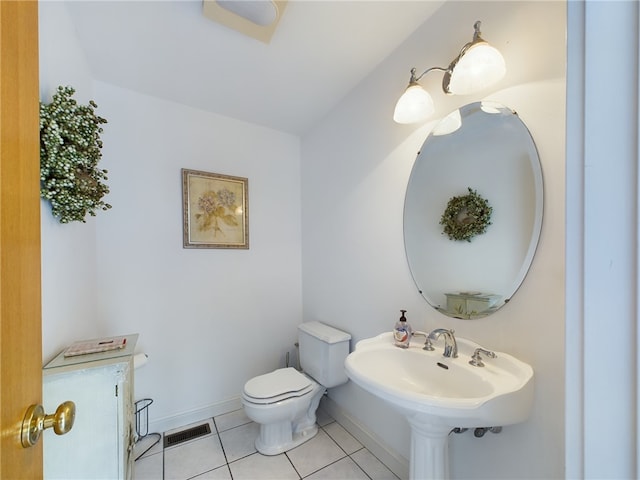 bathroom featuring tile patterned floors and toilet