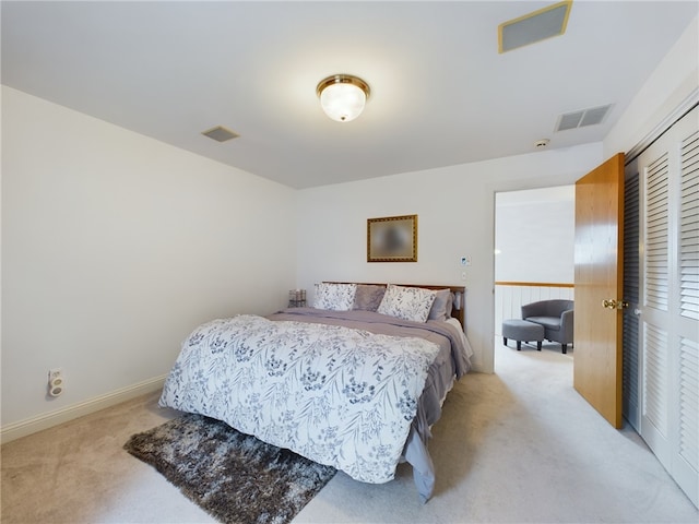 carpeted bedroom featuring a closet