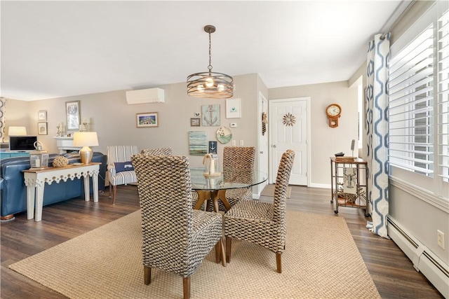 dining area featuring baseboard heating, a wall unit AC, dark wood-type flooring, and a notable chandelier