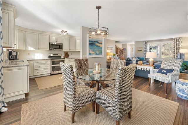 dining area featuring dark hardwood / wood-style flooring and sink