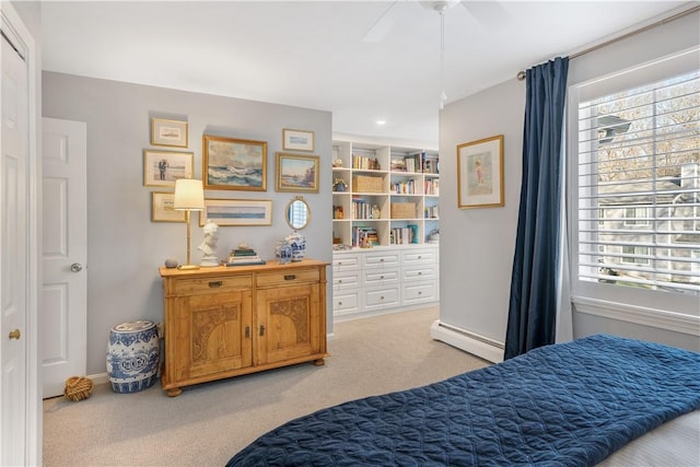 bedroom featuring ceiling fan, carpet floors, and baseboard heating