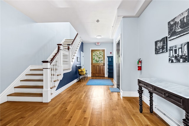 entryway with light hardwood / wood-style flooring