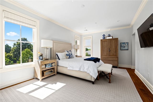 bedroom featuring hardwood / wood-style floors and ornamental molding