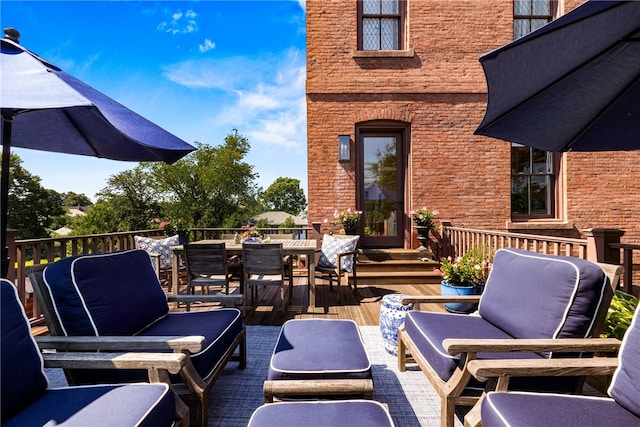 view of patio featuring a wooden deck and an outdoor hangout area