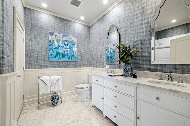 bathroom featuring vanity, toilet, and crown molding