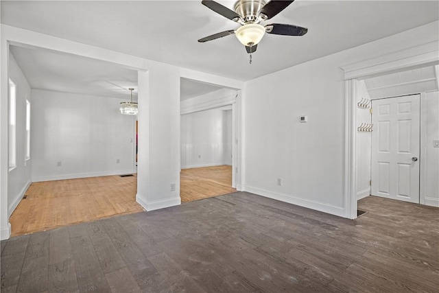 unfurnished room with dark hardwood / wood-style floors and ceiling fan