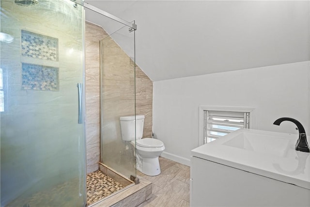 bathroom with vanity, toilet, walk in shower, and vaulted ceiling