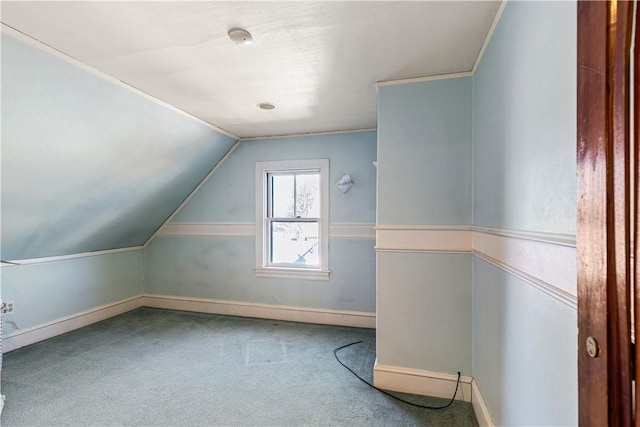 bonus room with carpet floors and vaulted ceiling