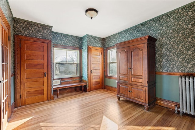 interior space featuring light hardwood / wood-style floors and radiator