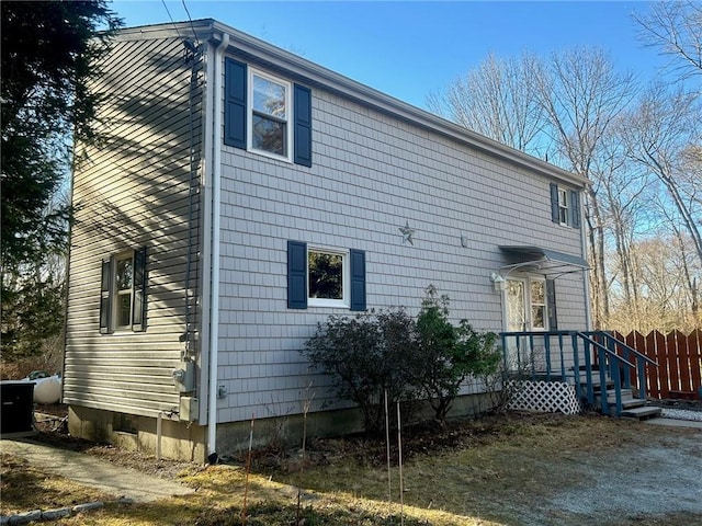 back of property featuring central AC unit