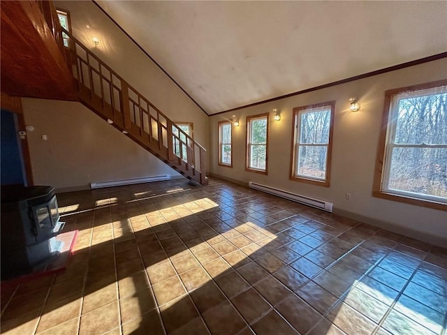 unfurnished living room featuring dark tile patterned flooring, lofted ceiling, a wood stove, and baseboard heating