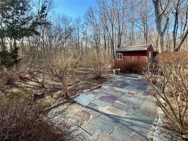 view of patio / terrace with a storage unit