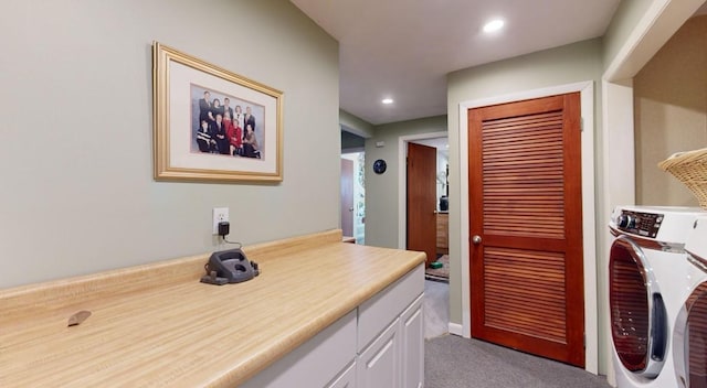 washroom with cabinets, washer / clothes dryer, and light carpet