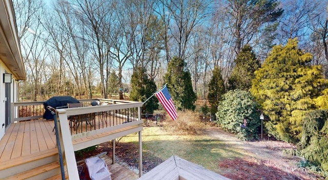 wooden terrace featuring area for grilling