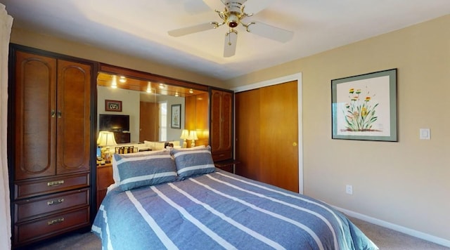 carpeted bedroom with a closet and ceiling fan