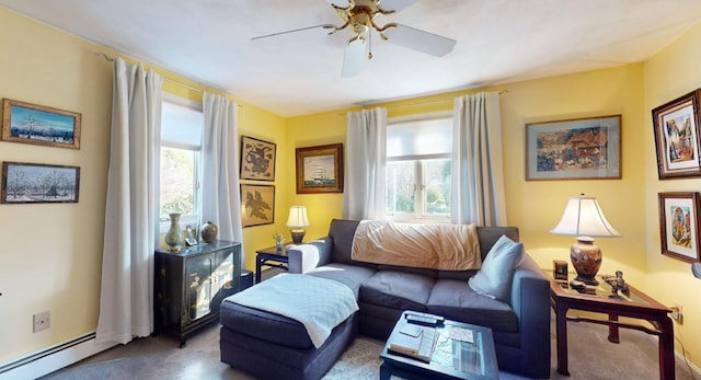 living room featuring a baseboard heating unit, ceiling fan, plenty of natural light, and carpet floors