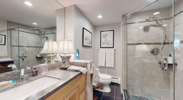 bathroom with toilet, tile patterned floors, vanity, a baseboard heating unit, and an enclosed shower