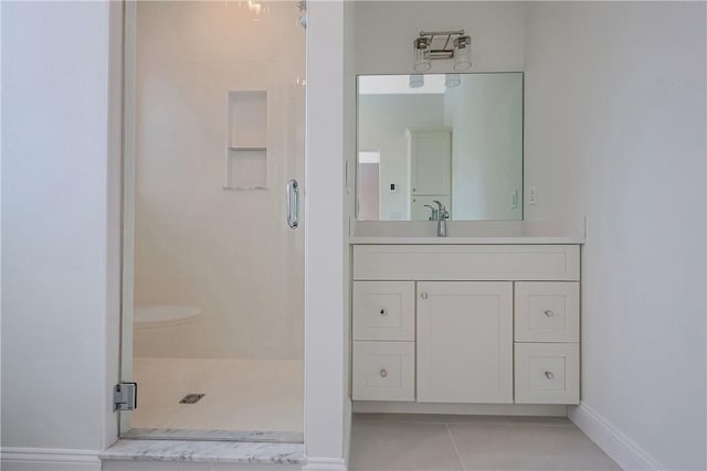 bathroom with vanity, tile patterned floors, and walk in shower