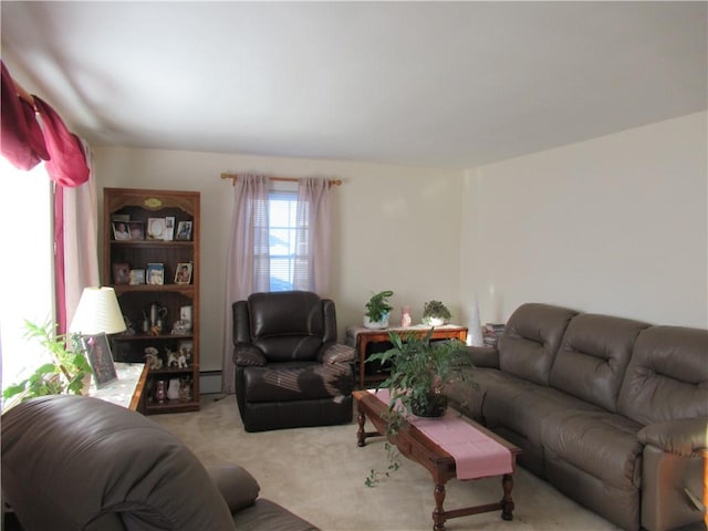 carpeted living room with a baseboard radiator