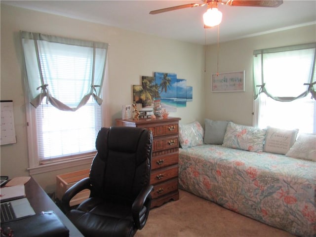 carpeted bedroom featuring ceiling fan