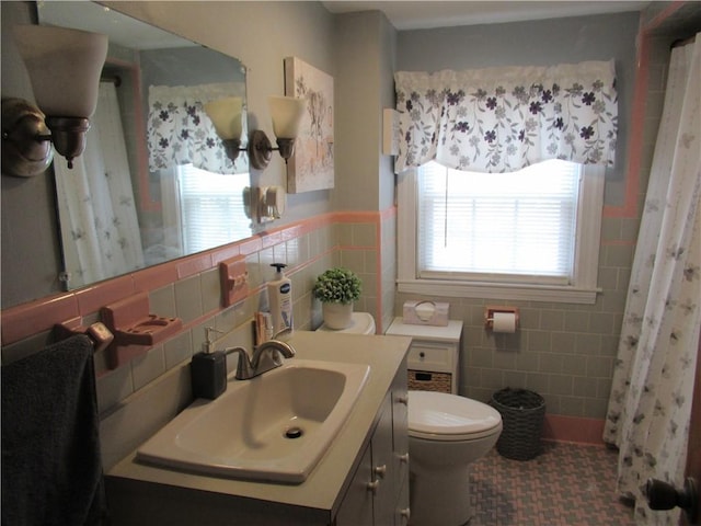 bathroom featuring vanity, a shower with shower curtain, decorative backsplash, toilet, and tile walls