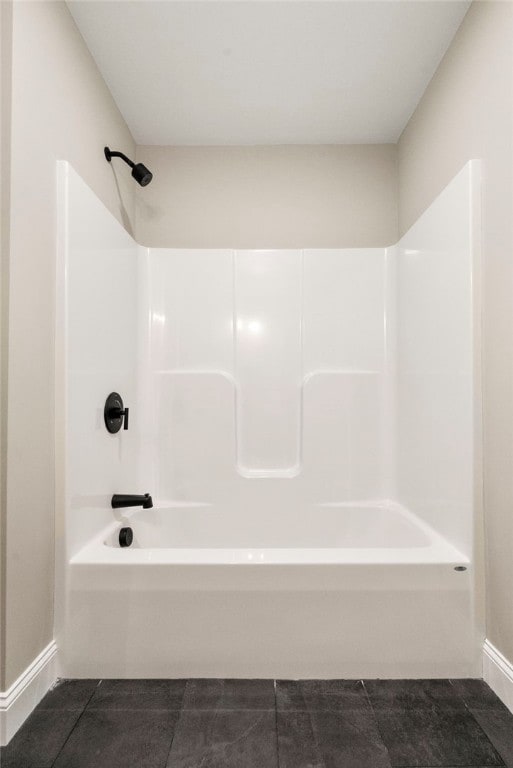 bathroom featuring bathing tub / shower combination and tile patterned floors