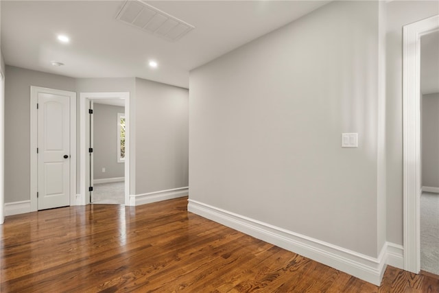 unfurnished room with hardwood / wood-style floors