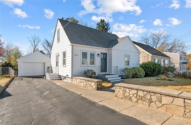 view of front of property featuring an outbuilding and a garage