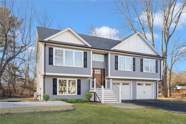 split foyer home featuring a front yard and a garage