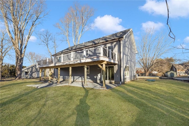 back of house with a yard, a patio, and a wooden deck