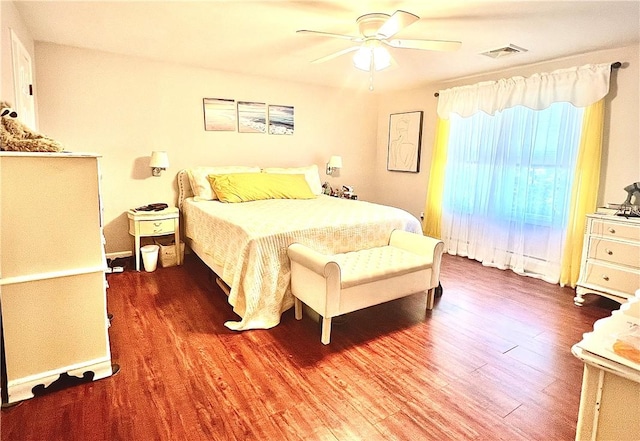 bedroom featuring ceiling fan and dark hardwood / wood-style flooring