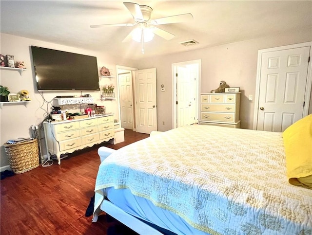 bedroom featuring ceiling fan and dark wood-type flooring