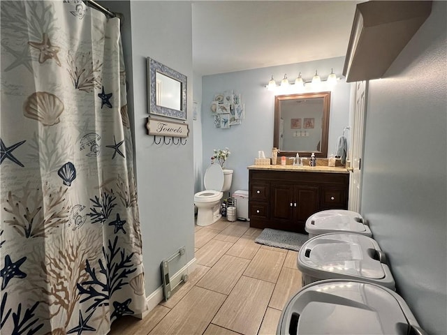 bathroom with toilet and vanity