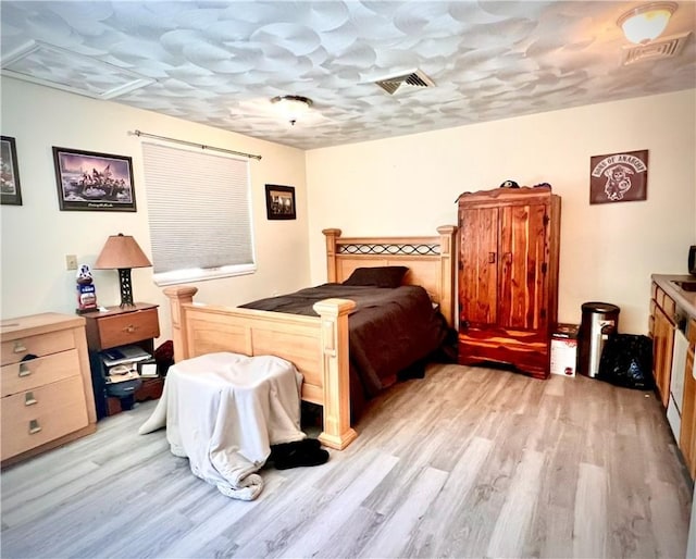 bedroom with light hardwood / wood-style floors